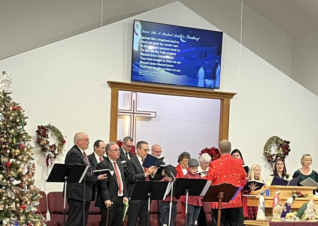 The adult choir singing during a service