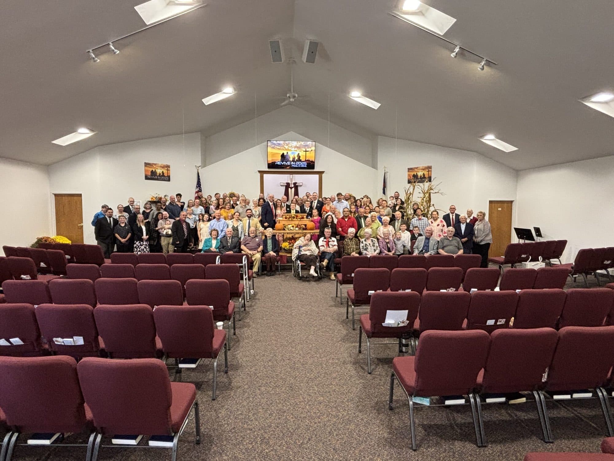 The congregation of Community Baptist Church of Lansing gathered at the front of the sanctuary