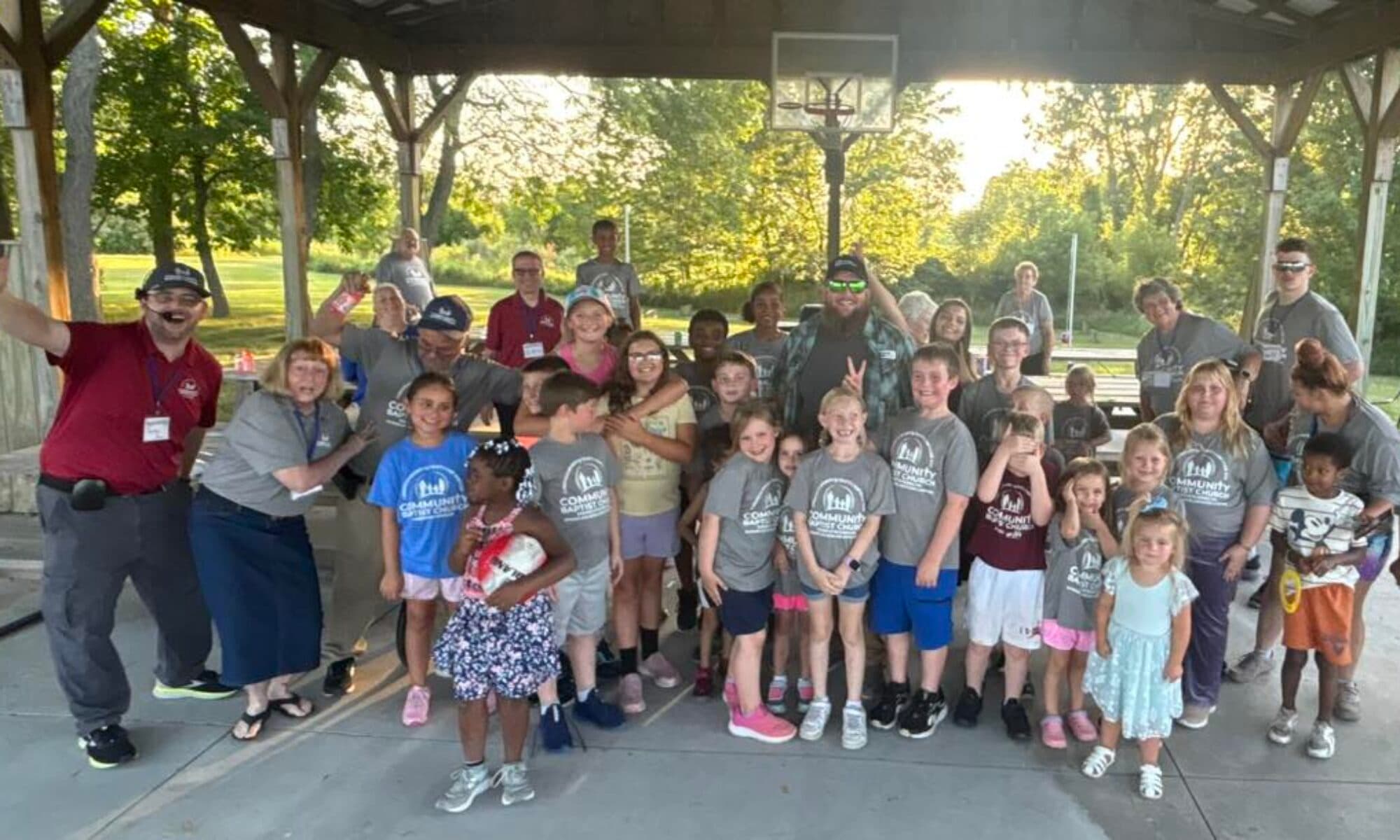 Children gathered outdoors at summer camp