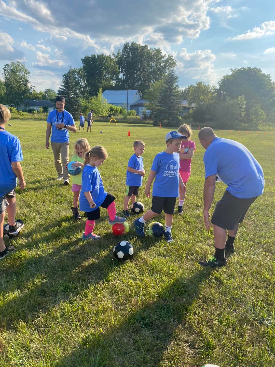 Children playing soccer at the church sports camp